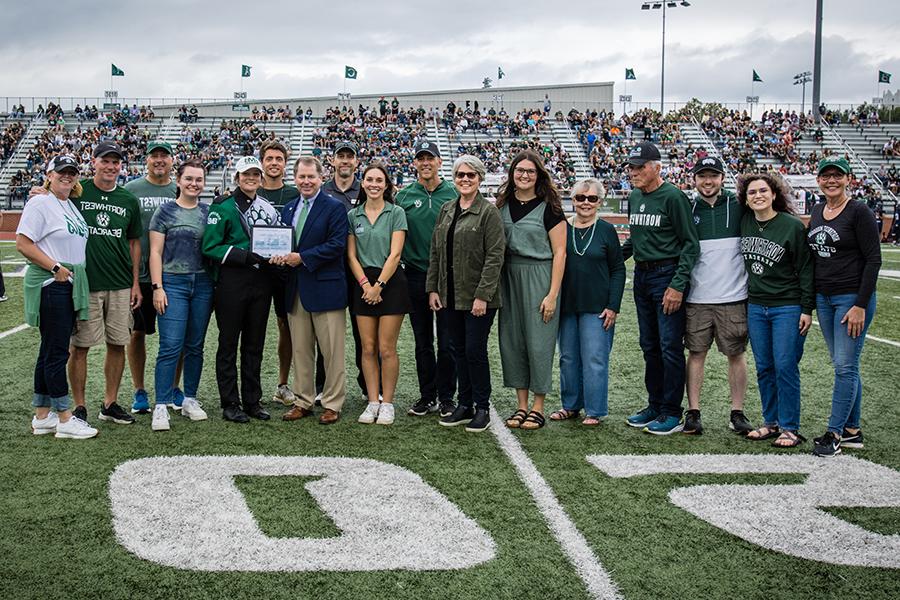The Norman family was honored as the 2023 Northwest Family of the Year. Left to right during their recognition last fall are Janne Collins Grover, Eryn Tinsman-Grover, Zach Grover, Gary Collins, Ramona Collins, Rylee Norman, Geri Collins Norman, Kevin Norman, Student Senate President Elizabeth Motazedi, Director of Alumni Relations Duane Havard, Northwest President Dr. Lance Tatum, Dillon Grover, Shelby Norman, Kinsey Collins, Kevin Grover, Brad Collins and Julie Callahan Collins. (Photo by Lauren Adams/Northwest Missouri State University)